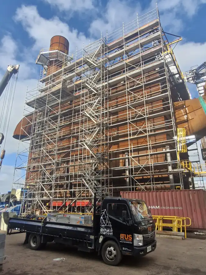 Scaffold framing around an industrial building